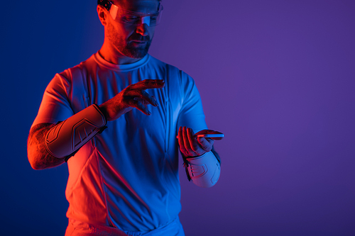 A man in a white shirt immersed in the metaverse with smart glasses in a studio setting.