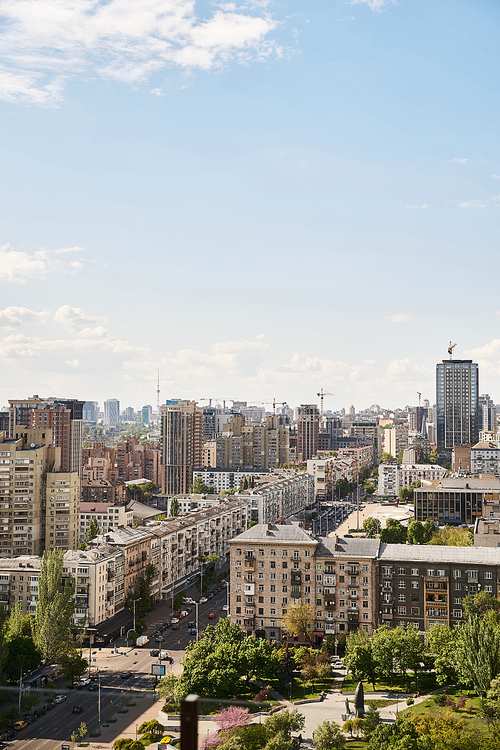 A bustling city with impressive skyscrapers dominating the skyline, showcasing the modern architecture and lively urban environment