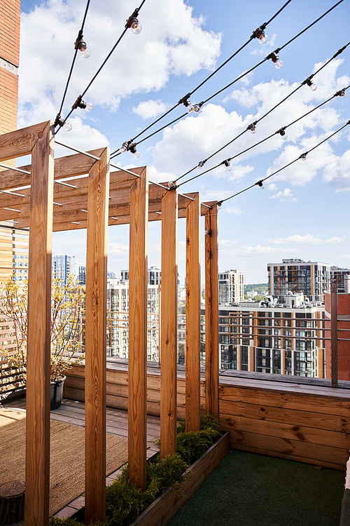 A wooden structure standing on top of a roof, creating a unique and cozy retreat space with a stunning view