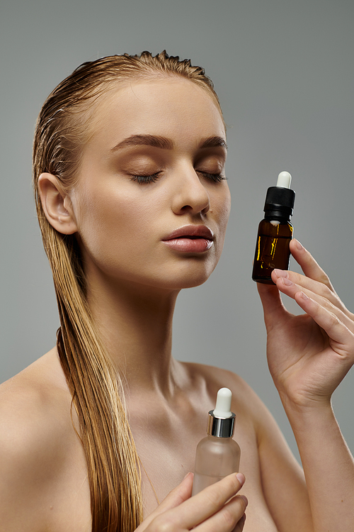 Young woman demonstrates hair care routine with wet hair, holding oil and lotion bottles.