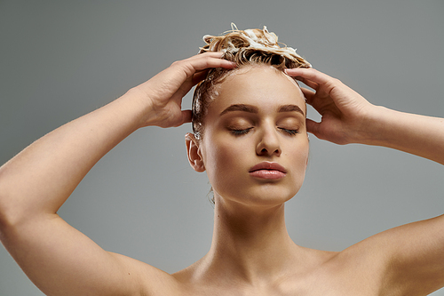 A young woman confidently displays her hair care routine with wet hair, showcasing a transformative moment.