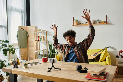 Young African American blogger energetically speaks on camera.