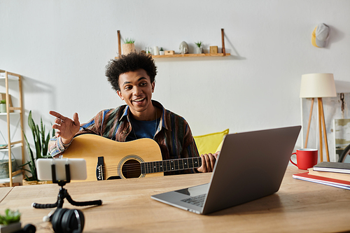 Young man strums acoustic guitar in front of phone, engaging with online audience.