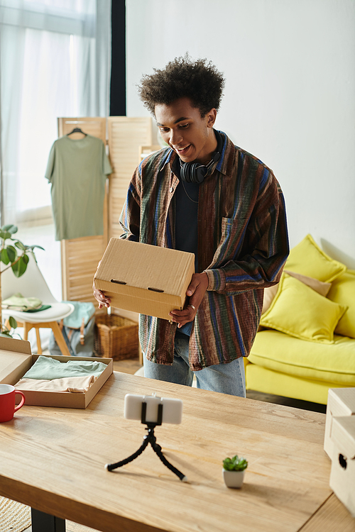 A man opening a box in a cozy living room.