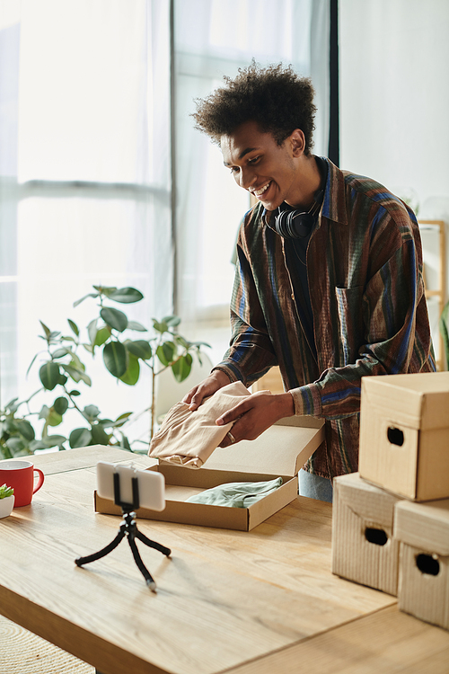 A man opens a box in his home office, vlog.