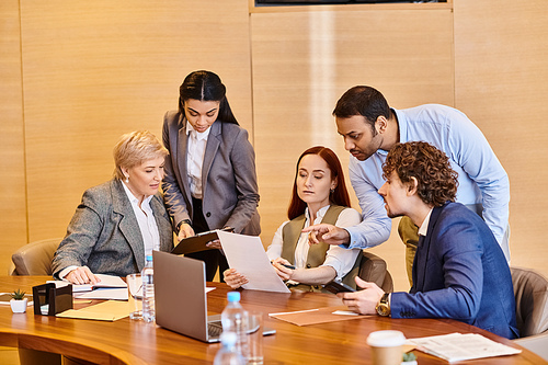 Multicultural group of business professionals discussing ideas in a meeting.