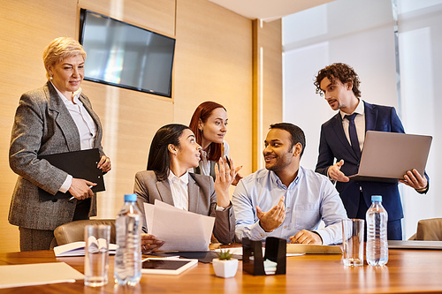 Multicultural professionals collaborating around a conference table.