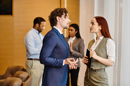 A man and a woman engage in deep conversation.