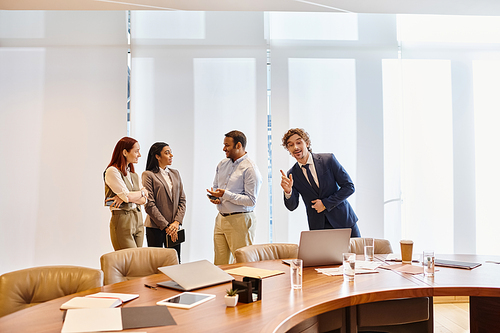 Diverse business professionals brainstorming around a conference table.