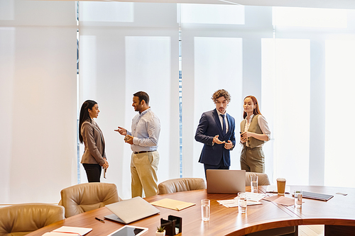 A diverse group of business professionals collaborating around a conference table.