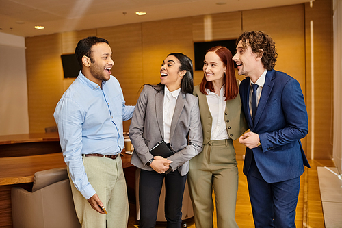 Diverse business professionals standing shoulder to shoulder in a room.