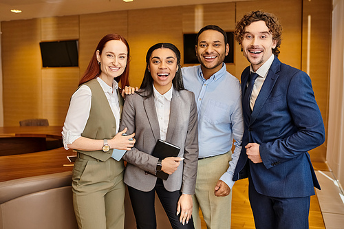 A diverse group of business people standing together in unity.