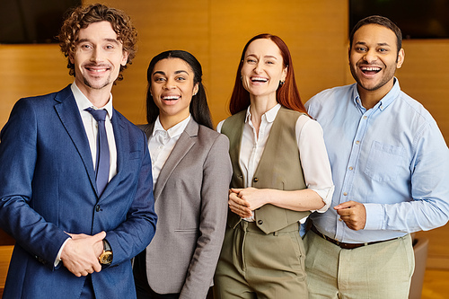 An interracial group of business people standing together.