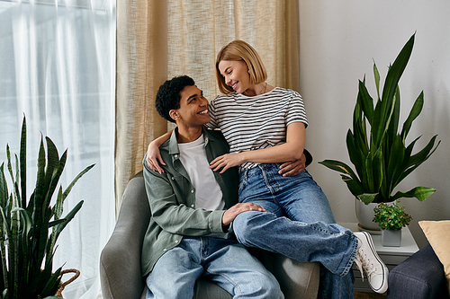 A young multicultural couple shares a loving moment in their modern apartment