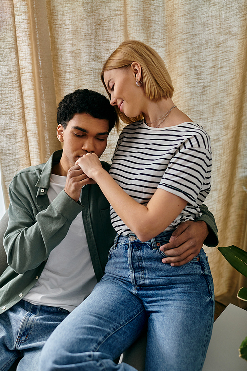 A young couple shares a tender moment in their modern apartment, showcasing the intimacy and connection they share.