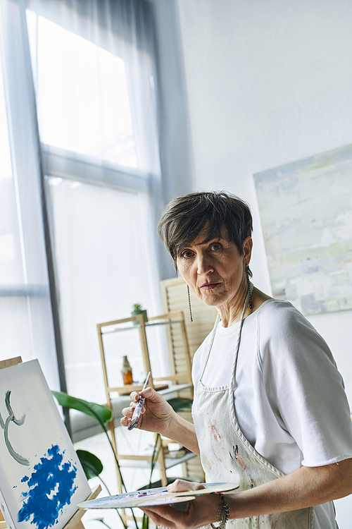 A dedicated painter captures inspiration in her airy art studio.