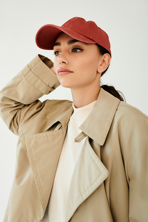 A young woman poses confidently in an on-trend autumn outfit, capturing the essence of seasonal style.