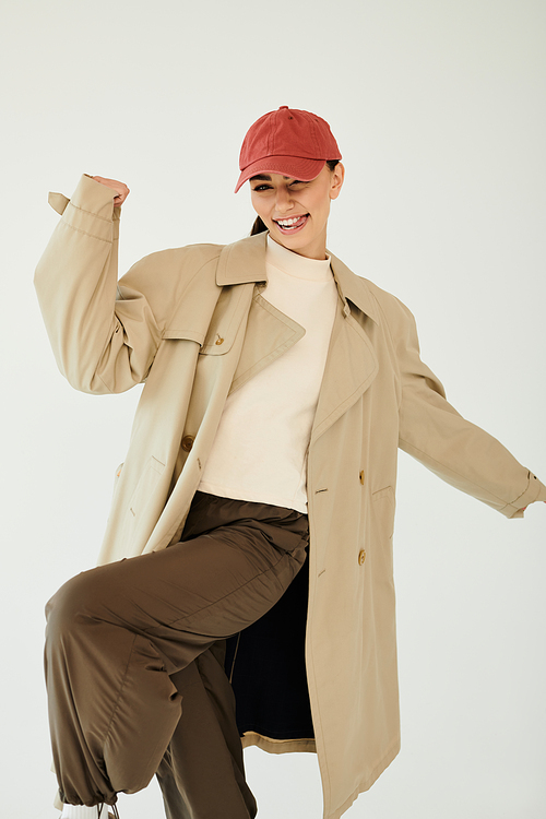 A young woman exudes confidence while posing in a fashionable autumn ensemble, ready to embrace the season.