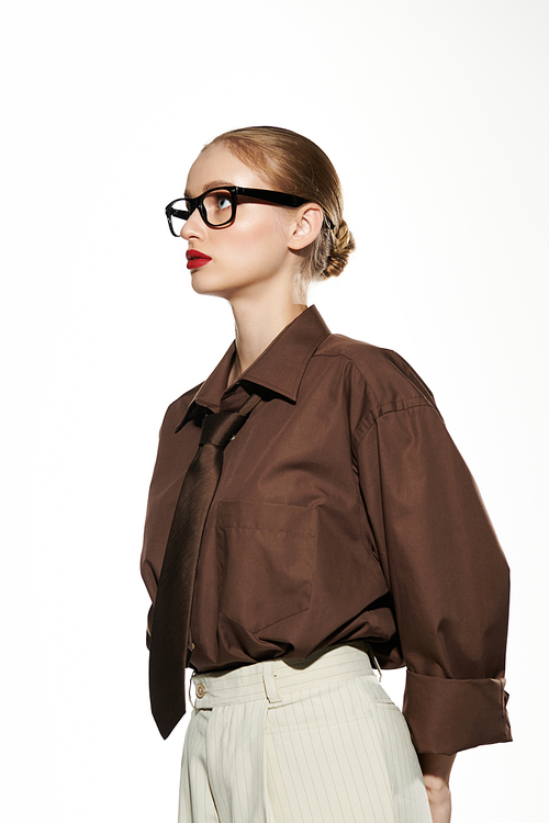 A young woman in a brown shirt and tie looks off to the side.