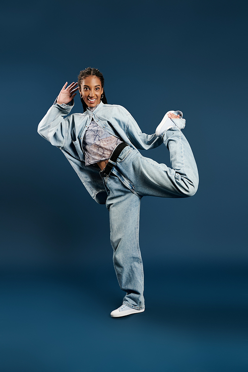 A confident young woman shows off her unique style in a playful pose.