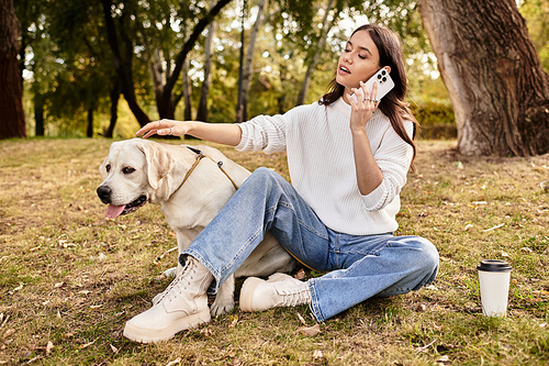 The serene atmosphere features a woman in cozy attire, bonding with her dog in autumns embrace.