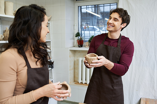 A loving couple crafts unique pottery in their cheerful studio.