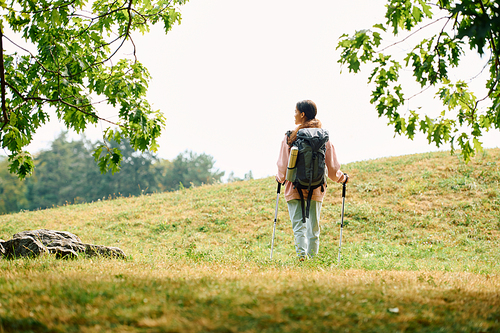 A young woman hikes through a colorful autumn forest, embracing nature and adventure with joy.