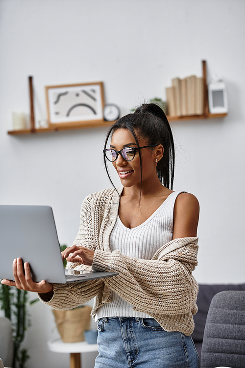 A cheerful woman engages in remote study while seated comfortably at home, feeling inspired.