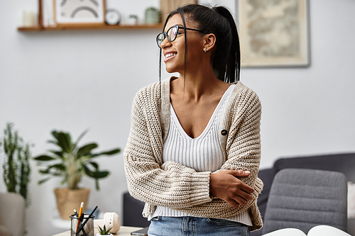 A young woman studies at home, dressed casually, smiling while embracing a joyful learning moment.