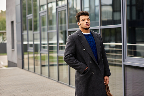 A charming man stands relaxed by a contemporary building, enjoying the vibrant atmosphere.