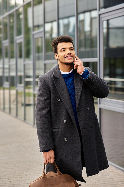 Charming man smiles while talking on his phone, dressed stylishly in a warm coat and sweater.