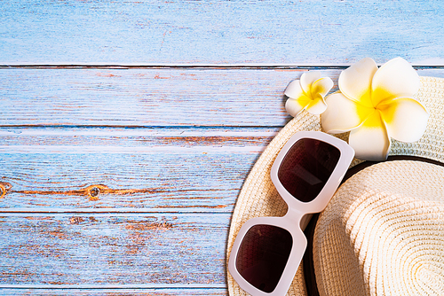 Beautiful summer holiday, Beach accessories, sunglasses, hat and flower on wooden backgrounds