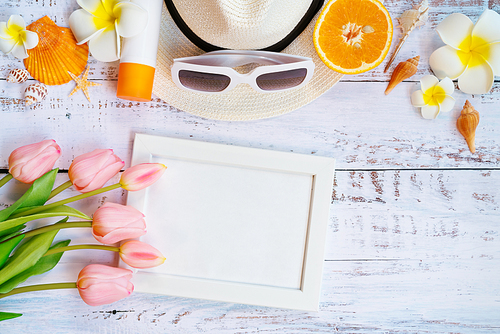 Beautiful summer holiday, Beach accessories, orange, sunglasses, hat and shells on wooden backgrounds