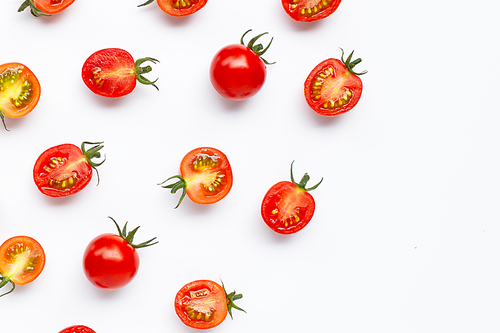 Fresh tomatoes, whole and half cut isolated on white. Top view