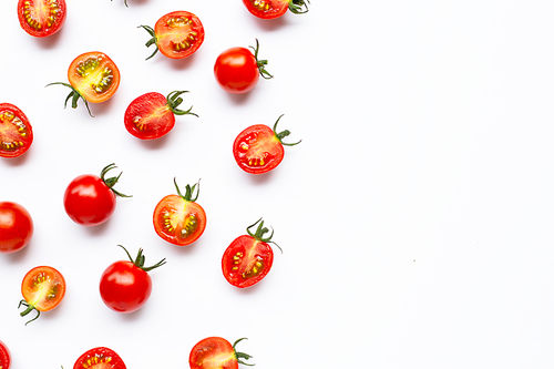Fresh cherry tomatoes, whole and half cut isolated on white. Copy space