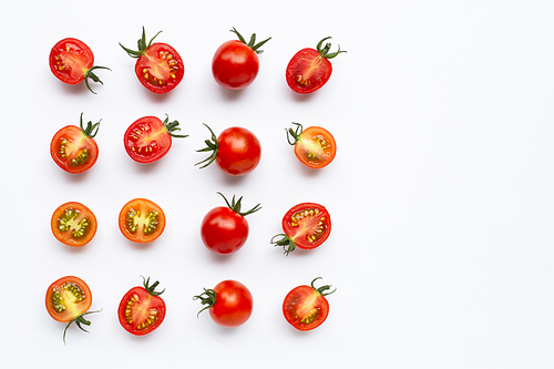 Fresh tomatoes, whole and half cut isolated on white. Copy space
