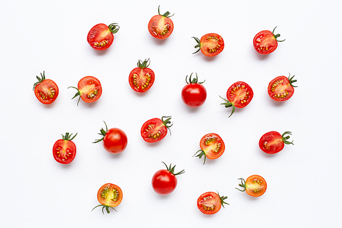 Fresh tomatoes, whole and half cut isolated on white. Top view