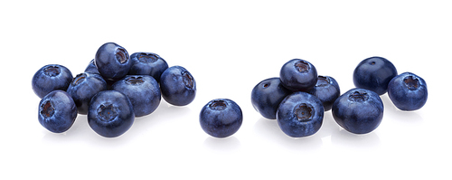 Blueberry isolated on white. A pile of fresh blueberries, fresh wild berries, ideal for use in packaging, close-up