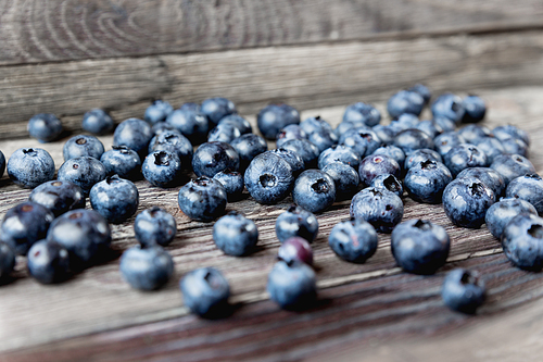 blueberries on rustic wooden cozy background. fresh-gathered berries full of vitamins, good for  nutrition and healthy meals.