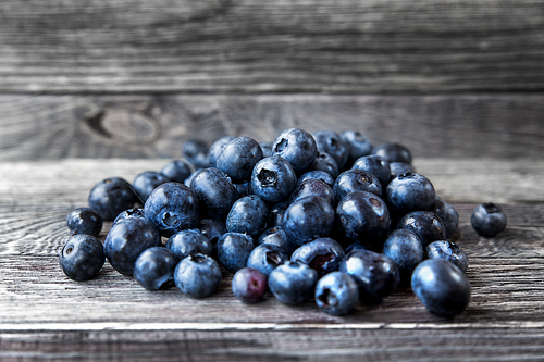 blueberry lie on wooden background. rustic cozy background with healthy food. fresh-gathered berries full of vitamins, good for  nutrition and healthy meals.