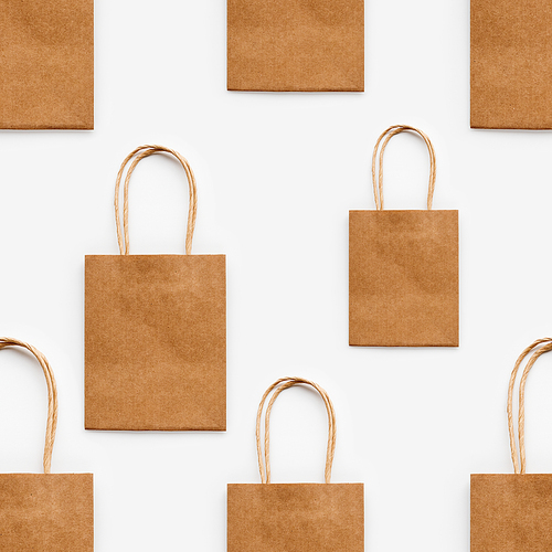 Photo seamless pattern with craft paper shopping bags. Zero waste lifestyle. Copy space.