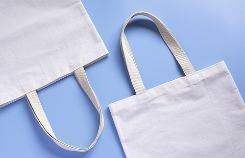 White tote bag canvas fabric. Cloth shopping sack mockup with copy space.