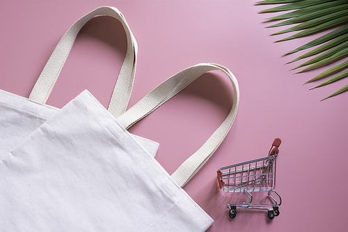 White tote bag canvas fabric and chopping cart. Cloth shopping sack mockup with copy space.