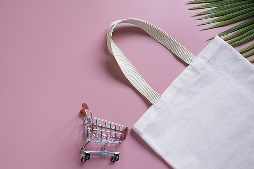 White tote bag canvas fabric and chopping cart. Cloth shopping sack mockup with copy space.