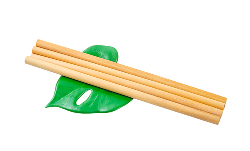 Bamboo straws tube for drink water with green leaf isolated on white, Save clipping path.
