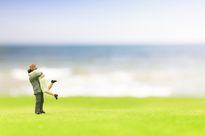 Miniature couple on the beach background