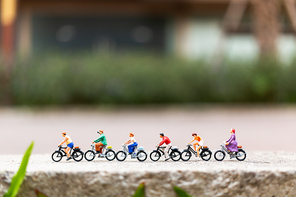 Miniature people travellers with bicycle in the park , Healthy lifestyle concept