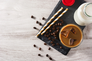 Iced coffee or caffe latte on wooden table