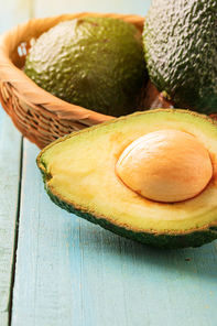 Avocado on old wooden table.