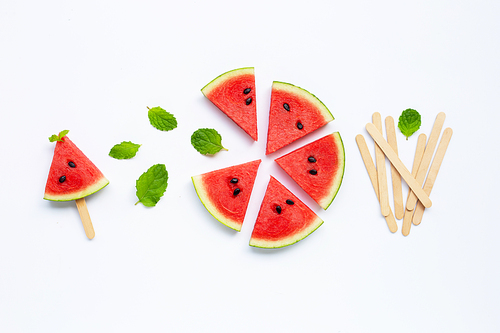 Slices of watermelon with popsicle on white background. Top view